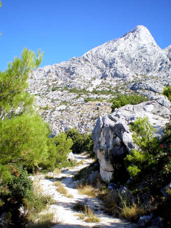 Mountain top on a background of the clear dark blue sky,    の写真素材