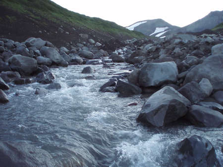 Mountain river current on stone