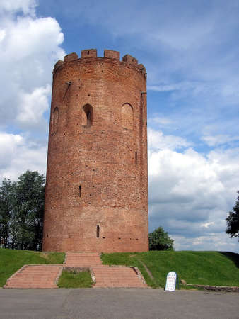 Historical brick tower on a background of the dark blue skyの写真素材