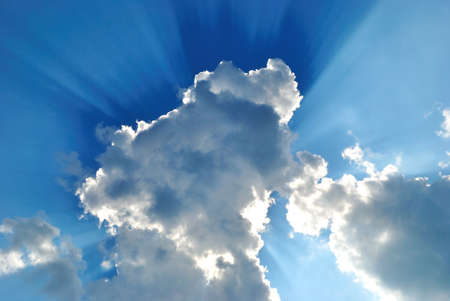 The Big cloud has closed the bright sun on turn blue the sky.の写真素材