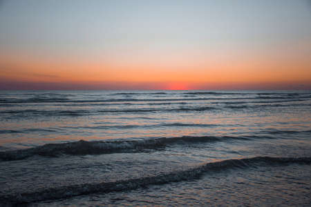 the seascape of the beginning of a new day, the sunrise in the seaの写真素材