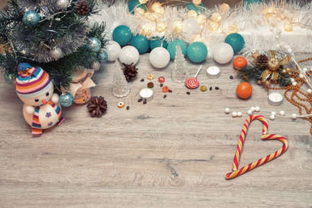 Christmas wooden background - textured wooden board with Christmas garland and free text space