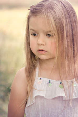 portrait of a very sad little girlの写真素材
