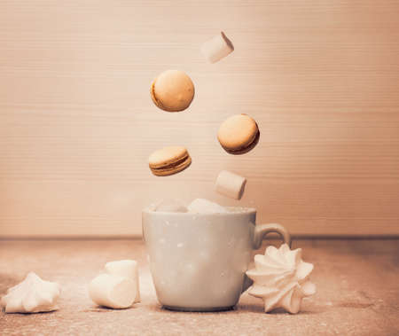 levitation macarons and marshmallow - retro picture of morning coffee with dessertの写真素材