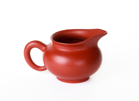 Small clay jug on a white background for the Chinese tea ceremonyの写真素材