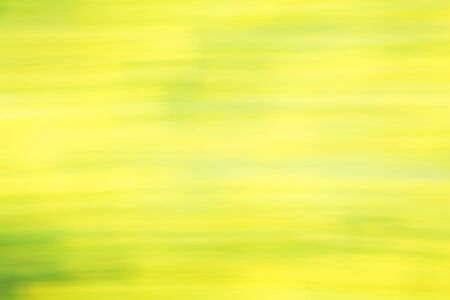 Photo art, bright Colorful light streaks abstract background in yellow and green colors, effect of movementの写真素材