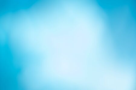 Abstract blue and white gradient background. Blurry defocused natural backdrop with bokeh lights. Soft summer, spring vibrant color and smooth wallpaper. Horizontal peaceful decorative imageの写真素材