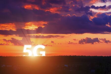 5G rises above the horizon. Network wireless systems and internet of things on surise background....