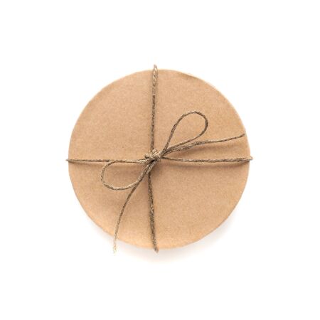 Craft box with ribbon isolated on white background. Holiday decoration and gifts. Wide angel view. Valentine present.の写真素材