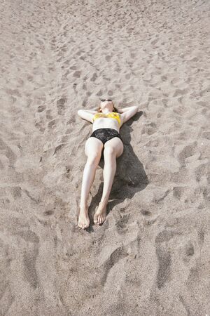 Young girl on beach. Summertime relax. Vacation travel concept. Happy people. Banner with copyspaceの写真素材