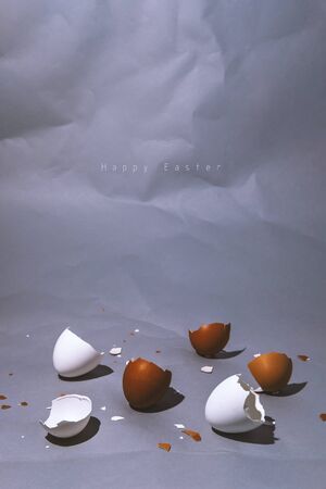 Easter egg, eggshell on vertical gray background with copyspace. Banner of macro moody minimalistic decoration concept. Stock photo.の写真素材