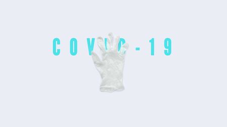 White protective medical glove on gray background with text. Banner of flu coronavirus Covid-19 and quarantine concept. Stock photo.の写真素材
