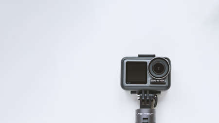 Chekhov, Russia - March 8, 2020: DJI Osmo Action isolated on white background with copyspace. Action camera for photo and video.のeditorial素材