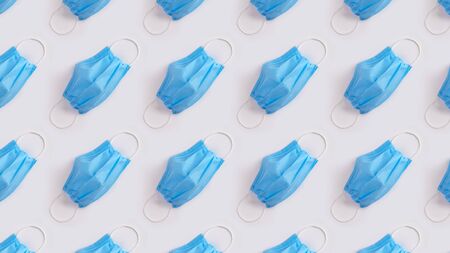 Blue protective medical mask pattern on gray background. Banner of flu coronavirus Covid-19 and...