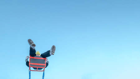 Girl swinging on swingの写真素材