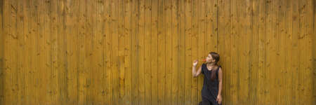 A cute young girl holding a lollipopの写真素材