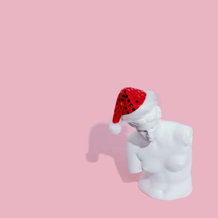 White woman statue on pink background
