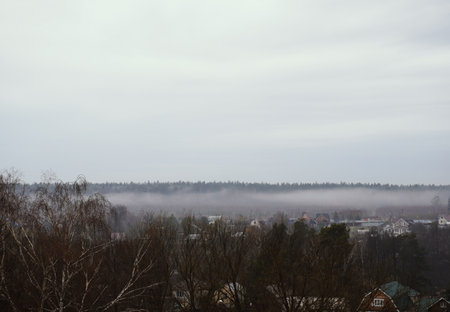 White fog spreads across the valley.の写真素材