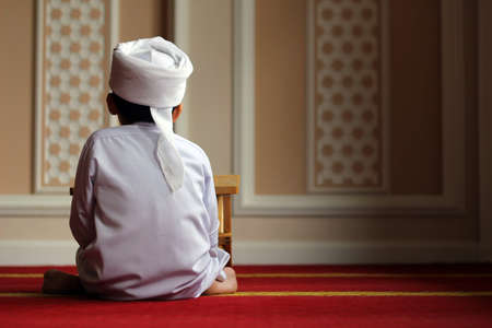 Young Boy with turban inside mosque