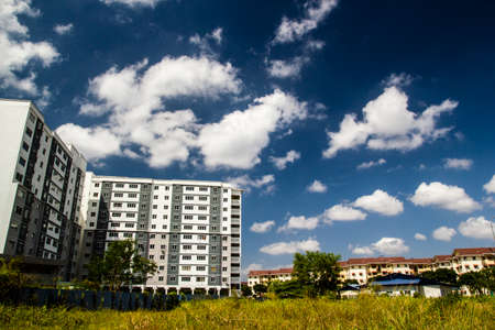 home building with Cloud in blue sky