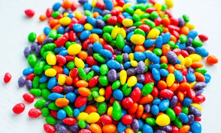 Multi-colored dragee on a white background