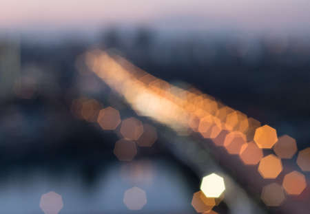 Abstract background with color bokeh effect.Template of blurred defocused lights for greeting, invitation card, banner and poster to celebrate on holiday seasonの写真素材