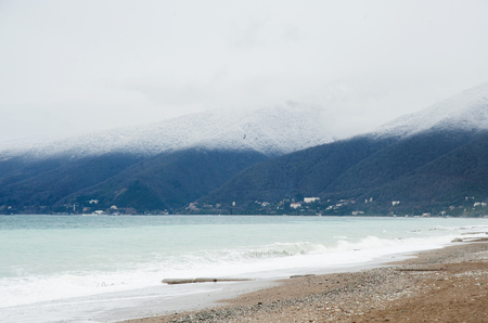 Winter seascape. Mountains covered with snow on the Black Sea coast in Abkhazia.の写真素材