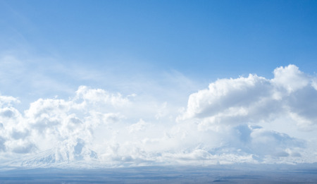 White clouds in a blue skyの写真素材
