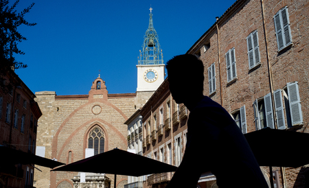 Silhouette of a young man riding a bicycle on Gambetta Square in Perpignan.の写真素材