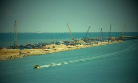 KERCH, RUSSIA, JULY 15, 2017: construction of a bridge with road and rail passages across the Kerch Strait, which will connect the Taman Peninsula and the Crimea.のeditorial素材