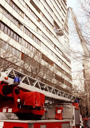 Fire with black smoke in multistory apartment building. Tonedの写真素材
