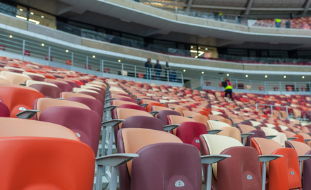 Multi-colored armchairs in a sports stadiumのeditorial素材