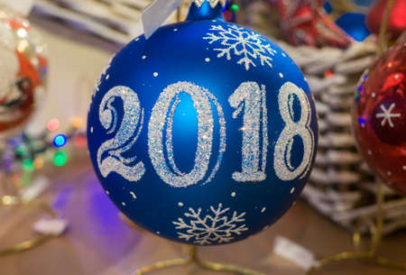 Blue Christmas tree toy in the form of a ball with the inscription 2018
