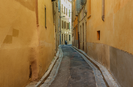 A narrow street in the European city.の写真素材