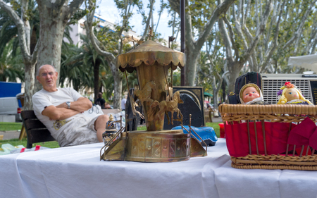 06 September 2014 Perpignan, France. Old Toy carouselon the flea market.のeditorial素材
