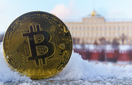 Gold coin bitcoin on the background of the Moscow Kremlin.の写真素材