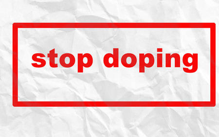 Caption Stop Doping on a crumpled sheet of white paperの写真素材