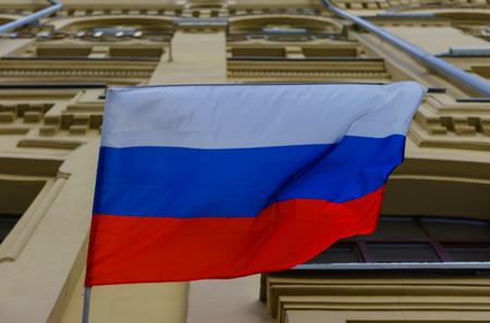 The national flag of the Russian Federation on the wall of the building.の写真素材