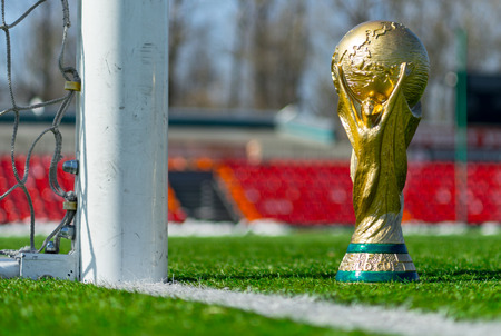 April 9, 2018 Moscow, Russia Trophy of the FIFA World Cup on the green grass of the football field.のeditorial素材