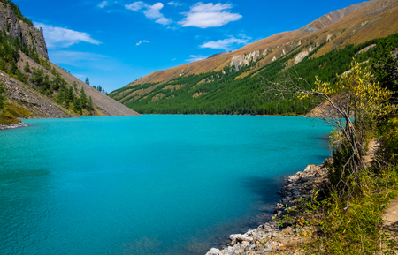 Mountain landscape. Mountain lake Shavlinskoe in the republic of Altai.の写真素材