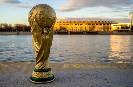 April 13, 2018 Moscow, Russia Trophy of the FIFA World Cup against the backdrop of the Luzhniki stadium in Moscow.のeditorial素材