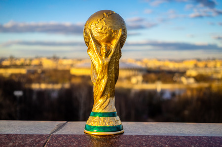 April 13, 2018 Moscow, Russia Trophy of the FIFA World Cup against the backdrop of the Luzhniki stadium in Moscow.