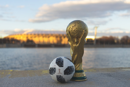 April 13, 2018 Moscow, Russia Trophy of the FIFA World Cup and official ball of FIFA World Cup 2018...