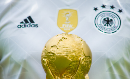 June 12, 2018 Moscow, Russia A man in the T-shirt of the German national football team holds the trophy of the FIFA World Cup.のeditorial素材