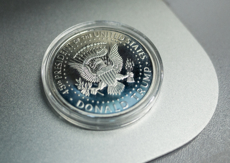 August 17, 2018 Washington, USA. Silver souvenir coin with the image of 45 US President Donald...