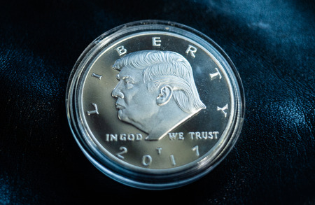 August 17, 2018 Washington, USA. Silver souvenir coin with the image of 45 US President Donald...