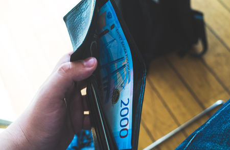 New banknote of two hundred Russian rubles in black leather wallet.の写真素材