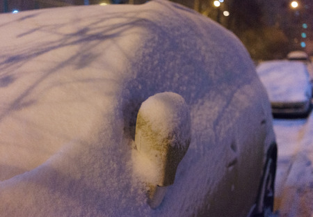 Car, covered with snow after a snowstorm.の写真素材