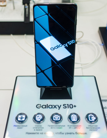 February 28, 2019 Moscow, Russia. The new smartphone from Samsung Galaxy s10+ on the shelf in the gadget store.のeditorial素材