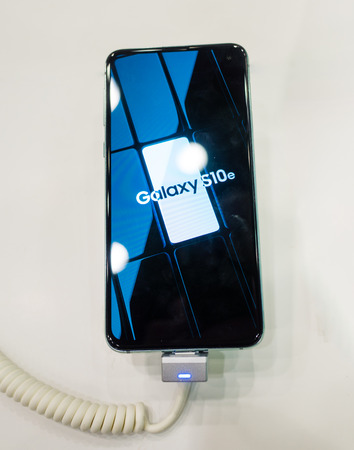 February 28, 2019 Moscow, Russia. The new smartphone from Samsung Galaxy s10e on the shelf in the gadget store.のeditorial素材